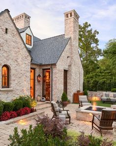 an outdoor patio with seating and fire pit