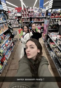 three girls in a store looking at the camera