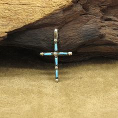 Experience the versatility and beauty of this exquisite reversible double-sided cross pendant, crafted with sterling silver and adorned with vibrant turquoise and coral stones. On one side of the pendant, there are five turquoise stones meticulously arranged to form a cross, each stone representing tranquility and protection. Flip the pendant, and discover the striking contrast of five coral stones elegantly arranged to create another cross, symbolizing vitality and passion. The stones measure 4 Spiritual Cross Turquoise Necklace For Gift, Spiritual Turquoise Cross Necklace As Gift, Spiritual Turquoise Cross Necklace For Gift, Spiritual Turquoise Cross Necklace, Silver Turquoise Cross Necklace For Gift, Spiritual Turquoise Necklace With Cross Pendant Gift, Spiritual Turquoise Cross Pendant Necklace Gift, Turquoise Cross Pendant Necklace As Gift, Handmade Turquoise Cross Necklace Spiritual