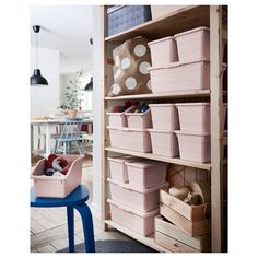 the shelves in this room are filled with plastic bins and containers for storage,