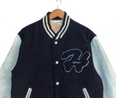 PLEASE ASK ANY QUESTION BEFORE BUYING THIS IS USED CLOTHING PLEASE DONT EXPECTED IT TO BE LIKE NEW OR IN PRISTINE CONDITION Vintage 90s Harvard University Button Down Varsity Jacket Blue Colour Wool Sweater Size Large Fit To Medium tag Harvard material Wool 100% saiz on tag L (Large) fit To Medium Mesasures About ( Approximately) -Armpit to Ampit : 22.5 inch -Length (back collar down) : 25 inch Condition : used good condition 7.5/10 **No Tears And No Stains** **Have a one Hole see a picture deta Winter Streetwear Button-up Varsity Jacket, Blue Varsity Jacket With Button Closure For Streetwear, Winter Button-up Varsity Jacket, Winter Varsity Jacket With Buttons, Blue Varsity Jacket For Streetwear, Blue Buttoned Outerwear For Streetwear, Retro Varsity Jacket With Button Closure For Winter, 90s Style Winter College Varsity Jacket, Vintage Varsity Jacket With Button Closure For Winter