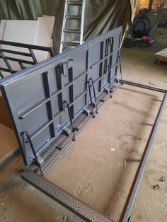 the metal frame is ready to be installed in the shop or workshop for repairs and remodeling