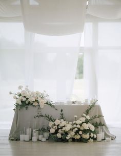 a table with candles and flowers on it