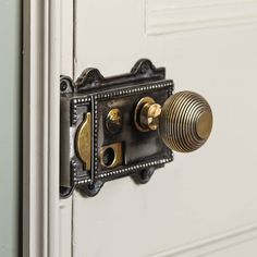 an old door handle with two knobs on the front and side of the door