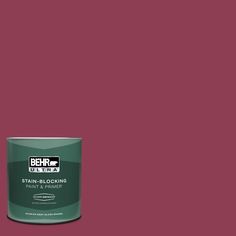 a can of behrut ultra stain - blocking paint on a red background,