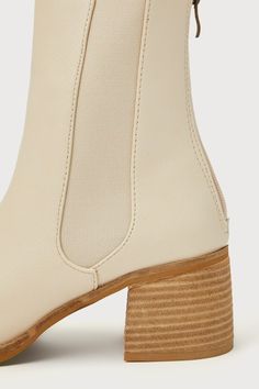 All your favorite fall 'fits are definitely going to include the Karlach Light Nude Low Heel Ankle Booties! Faux pebbled leather shapes these essential autumn boots that feature an almond-shaped toe upper and a 6.25"" ankle-high shaft with a 5.5"" zipper at the back and elastic gussets on either side. A stacked block heel completes the trendy look! 2. 5" stacked wood-look block heel. Lightly cushioned insole. Nonskid rubber sole. Man made materials. Imported. Lulus | Karlach Light Nude Low Heel Beige Chelsea Ankle Boots For Fall, Beige Ankle Chelsea Boots For Fall, Beige Faux Leather Boots For Work, Beige Booties With Reinforced Heel For Fall, Beige Ankle Chelsea Boots Medium Width, Beige Faux Leather Boots With Reinforced Heel, Cream Faux Leather Boots Medium Width, Fall Beige Booties With Reinforced Heel, Beige Medium Width Chelsea Ankle Boots