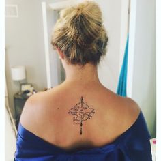 a woman with a tattoo on her back