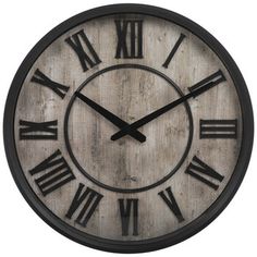 a large clock with roman numerals is shown in black and white color scheme