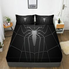 a bed with black and white spider - man pattern on it