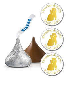 three herss kisses stickers on top of a piece of foiled chocolate covered candy