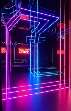 an empty room with neon lights in it