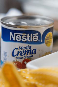 a can of yogurt sitting on top of a table