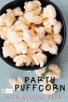 party popcorn with almond bark in a black bowl on a blue tablecloth and text overlay reads party popcorn with almond bark