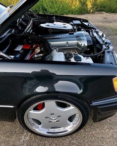 the engine compartment of a black sports car