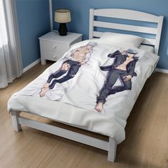 the bed is made up with two anime characters on it's covers and pillows