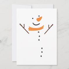 a card with an image of a snowman's face and two brown sticks sticking out of it