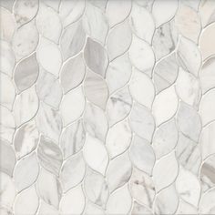 a white marble mosaic tile with wavy lines