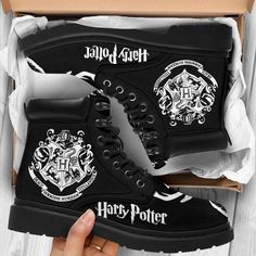 harry potter high top sneakers with hogwart crests on the side in a box