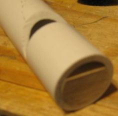 a close up of a white object on a wooden surface