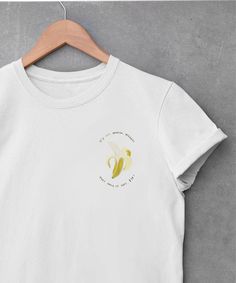 "Lucille Bluth, matriarch. what a complete treasure chest logo design with painted banana and \"it's ONE banana, Michael. what could it cost, $10?\" white cotton bella + canvas 3001 tee  soft and lightweight  high quality screenprint crew neck short sleeves unisex fit men's sizes small to 3xl runs true to size your shirt will be professionally printed and shipped as soon as your order is placed! current print time is about 3-5 days, shipping time varies: US 3-5 days Canada 10-15 days everywhere Chest Logo Design, Lucille Bluth, Banana Shirt, 10 Dollars, One Banana, Family Shirt, Treasure Chest, Family Shirts, Mens Fitness