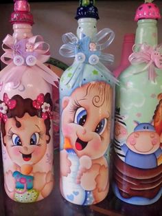 three children's bottles sitting on top of a table