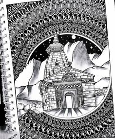 a spiral notebook with an image of a building in the middle and mountains behind it