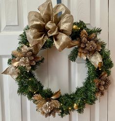 a christmas wreath hanging on the front door