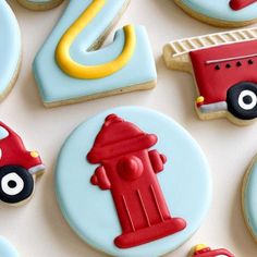 cookies decorated like cars, trucks and fire hydrants