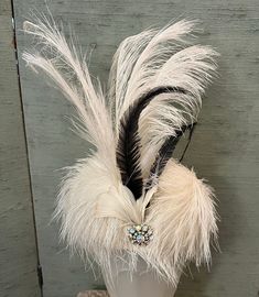 1920 vintage white aigrette feathered hat with white and black plumes standing 7 inches high with a gorgeous rhinestone pin nestled in the front of the dome base. This is a spectacular hat, beautifully preserved and ready for a party or Ascot or both! Size 22", dome 5", plume 7". Flapper Evening Headpiece With Feathers, White Feathered Evening Headpieces, White Feathered Headpieces For Evening, White Feather Headpieces For Evening, Formal Gatsby Headpiece With Feathers, White Ostrich Feather Headpiece With Feather Trim, Feathered Hat, Textiles Projects, Feather Hat