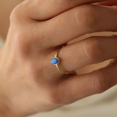 14k Opal Ring,Dainty Ring, Blue Opal Ring,Minimalist Ring, Real Opal ring ❤️Minimalist look and dainty design❤️ ABOUT PRODUCTS; Handmade with 14k Gold,925 Solid Sterling Silver We have color options. Silver Gold Rose gold Comes with a stylish gift-ready elegant jewelry box ** ANY PROBLEMS AND PLEASE CONTACT ME IN ORDER CONTENT, THANK YOU ** Everyday 14k Yellow Gold Opal Ring, Dainty Opal Ring With Birthstone In Round Band, Minimalist Opal Stackable Promise Rings, Everyday 14k Gold Opal Ring, Dainty Yellow Gold Opal Ring As Gift, Oval Dainty Rings With Simple Design, Dainty Oval Rings With Simple Design, 14k Gold Stackable Opal Promise Ring, Minimalist Opal Rings With Birthstone