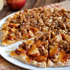 an apple pie is on a white plate