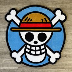 a sticker with a skull wearing a hat on it's head and two crossed bones