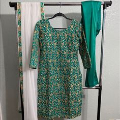 Teal Green Color Suit With Detailed Embroidery On Both Front And Back. Paired With Matching Lacra Pajami. And White Net Chunni With Matching Teal Border. Estimated Measurements ~ Suit- Bust 42, Waist 40, Length 40. Margins 3’ Each Side *Almost All Outfits And Jewelry Pieces Are Pre Worn. Worn Items Will Show Signs Of Wear, And Are In The Same Condition As Shown In The Pictures. Items Are Not Worn After The Pictures Have Been Taken And Are Stored Away. All Sales Final* Zardosi Embroidery, Teal Green Color, Teal Green, Custom Made, White, Green, Women Shopping, How To Wear, Color