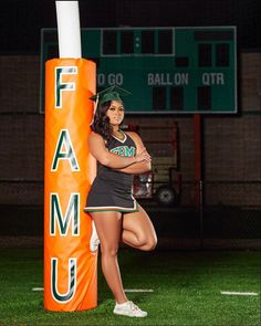 a female football player posing next to an orange pole with the word famu on it