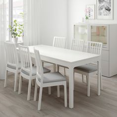 a white table and chairs in a room