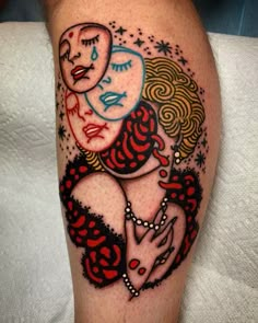 a woman's leg with an image of two women on it and stars in the background