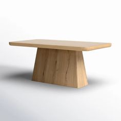 a wooden table sitting on top of a white floor