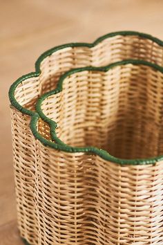 a wicker basket sitting on top of a wooden table