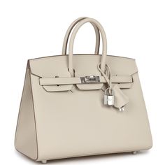 This Birkin is in Craie epsom leather with palladium hardware and has tonal stitching, front flap, two straps with center toggle closure, clochette with lock and two keys, and double rolled handles.The interior is lined with Craie chevre and has one zip pocket with an Hermes engraved zipper pull and an open pocket on the opposite side.Collection: WOrigin: FranceCondition: New and never worn (Plastic on hardware)Accompanied by: Hermes box, Hermes dustbag, clochette, lock, two keys, clochette dustbag, felt, carebookMeasurements: 10" width x 7.5" height x 4.75" depth; 2.75" handle drop Hermes Birkin Sellier, Birkin Sellier, Birkin Kelly, Hermes Birkin 25, Hermes Box, Kelly Bag, Luxury Purses, Chunky Jewelry, Fancy Bags