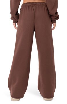 Let 'em know you're here for the drama in cotton-blend sweatpants fashioned with a low rise and wide leg. 50% cotton, 50% polyester Machine wash, line dry Imported Brown Sweatpants Outfit, Brandy Sweatpants, Wide Sweatpants, Brown Sweatpants, Sweatpants Style, Swimwear Dress, Adjustable Waistband