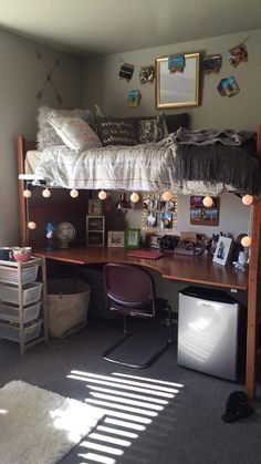 a bedroom with a loft bed and desk