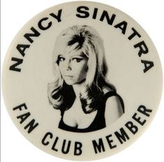 a button with an image of a woman's face and the words fancy santa fe fan club member