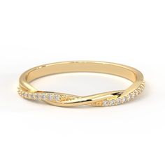 a yellow gold wedding band with white diamonds on the sides and an elegant twist in the middle