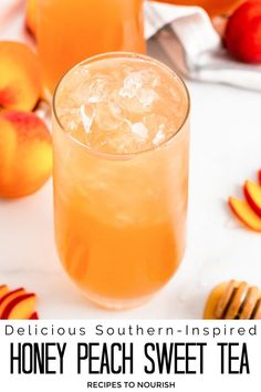 Photo of a glass filled with crushed ice and peach tea, surrounded by whole peaches, peach slices, a wooden honey dipper dipped in honey and a glass filled with peach tea in the background with text that says Delicious Southern-Inspired Honey Peach Sweet Tea.