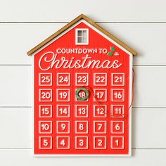 a red house shaped like a calendar with the words countdown to christmas written on it