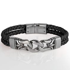 This stylish men's bracelet features a braided genuine black leather strap with a premium grade 316L solid stainless steel finish. Fits up to an 8" wrist, magnificent presentation case included. Modern Leather Braided Bracelet With Black Band, Modern Braided Leather Bracelets With Black Band, Elegant Black Metal Braided Bracelets, Black Chain Bracelet With Adjustable Stainless Steel Clasp, Adjustable Black Chain Bracelet With Stainless Steel Clasp, Modern Black Braided Bracelets With Stainless Steel Clasp, Modern Black Braided Bracelet With Leather Strap, Modern Leather Braided Bracelets, Black Stainless Steel Wristband