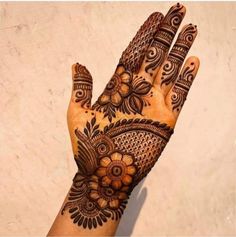 a henna tattoo on someone's hand