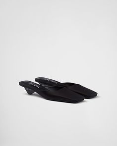 Black Satin Mules | PRADA Designer Low Heel Business Heels, Designer Low Heel Shoes For Business, Designer Low Heel Heels For Business, Classic Formal Sandals With Flat Heel, Designer Heels With Removable Insole For Work, Black Pointed Toe Business Sandals, Designer Workwear Heels With Removable Insole, Black Pointed Toe Sandals For Business, Designer Formal Mules With Contrasting Heel