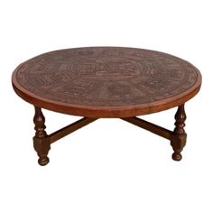 a wooden table with carvings on it