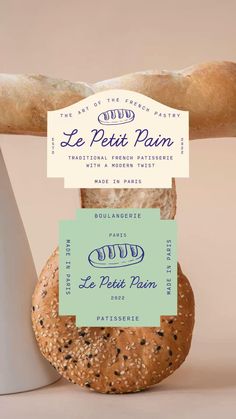 a loaf of bread sitting on top of a counter next to a sign that says le petit pain